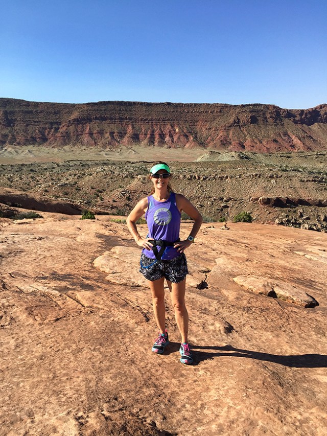 Photo of Becky Aaronson running on the trail to Delicate Arch 