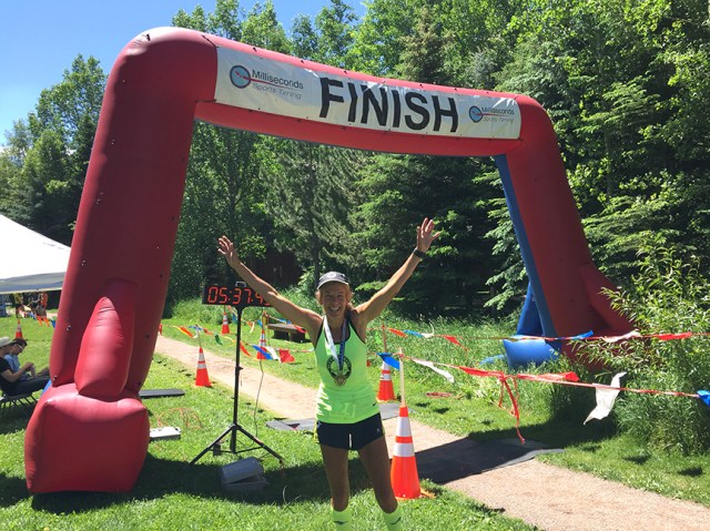 Photo of Patty Bryant at the finish line of the Aspen Backcountry Marathon